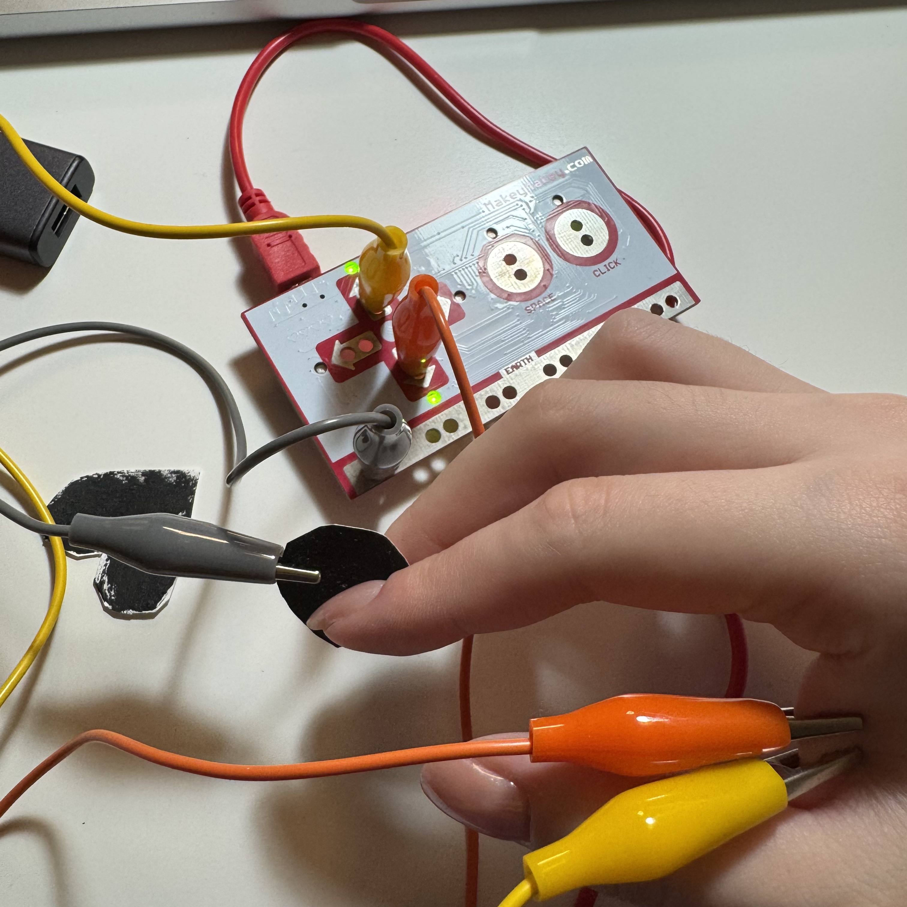 I put two alligator clips on my skin and my finger on the graphite button to test the usability